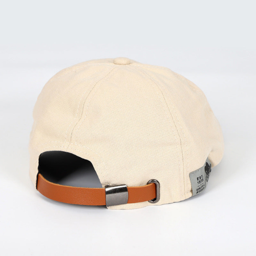 Flat lay of a sophisticated men's adjustable beret, essential elegant fashion accessory