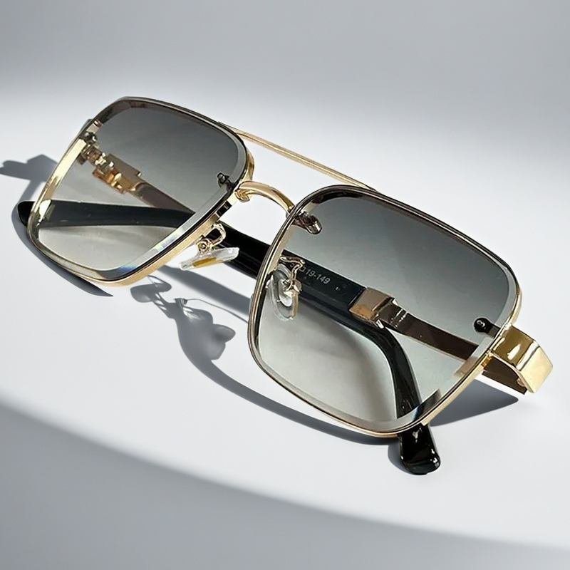 Chic unisex squared sunglasses with a sleek gold frame. Gradient lenses offer UV protection for a modern look.