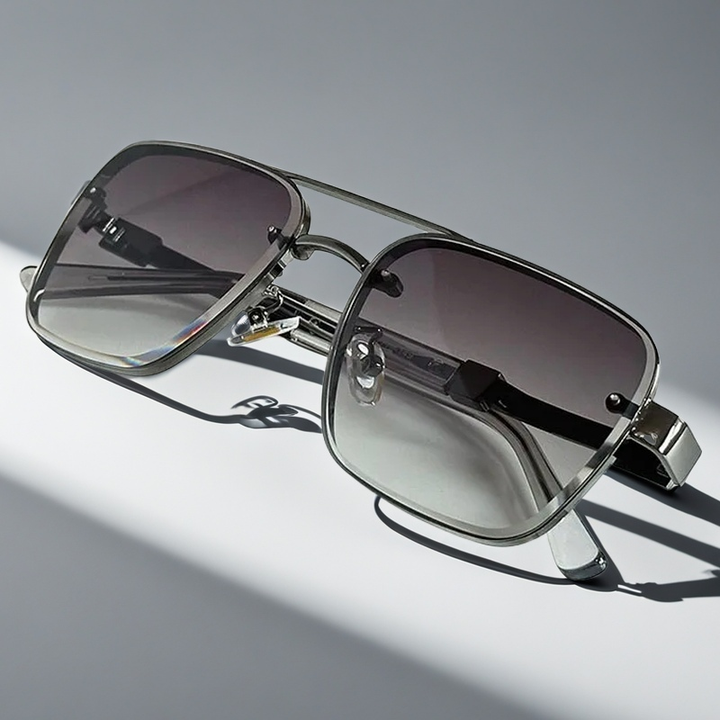 Elevate your style with elegant unisex squared frame sunglasses. Gold frame, gradient lenses & UV protected.