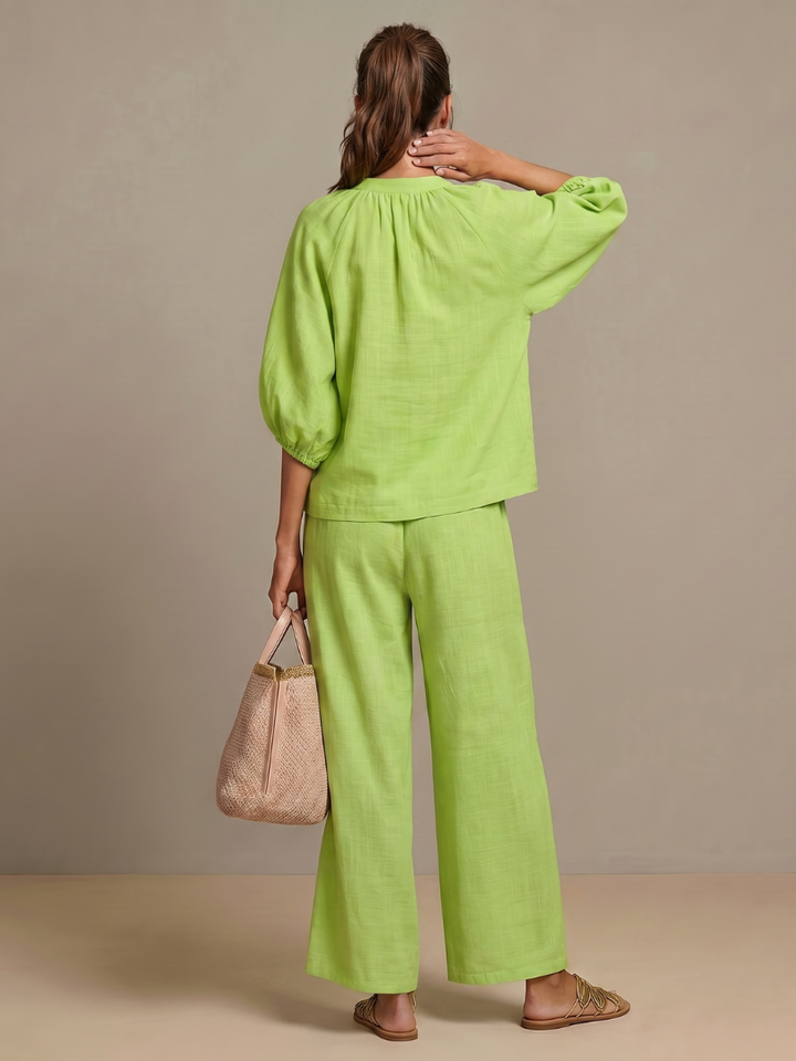 Spring/summer women's set: zip front blouse and relaxed fit wide-leg pants. Perfect for casual comfort.
