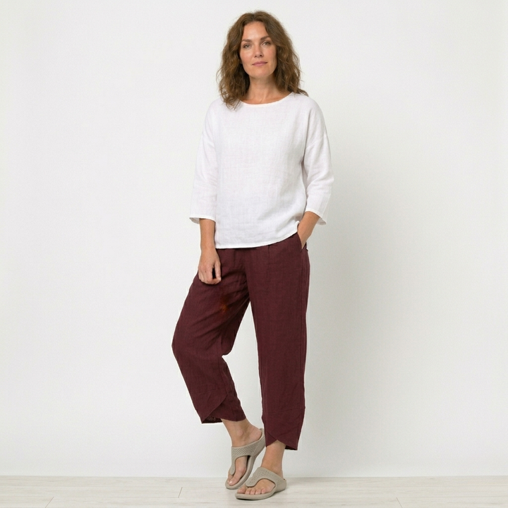 Stylish women's high-waisted pants with a unique tulip hem. Comfortable and breathable casual wear.