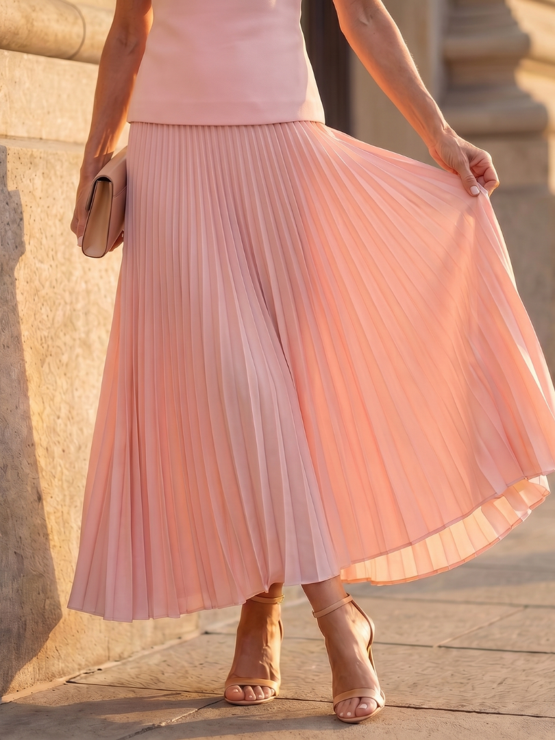 Chic women's structured bodice & pleated skirt set, perfect for formal or casual events. Two-piece outfit.