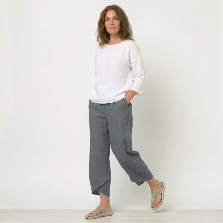 Modern women's high-waisted pants with a distinctive tulip hem. Breathable and comfortable for daily wear.