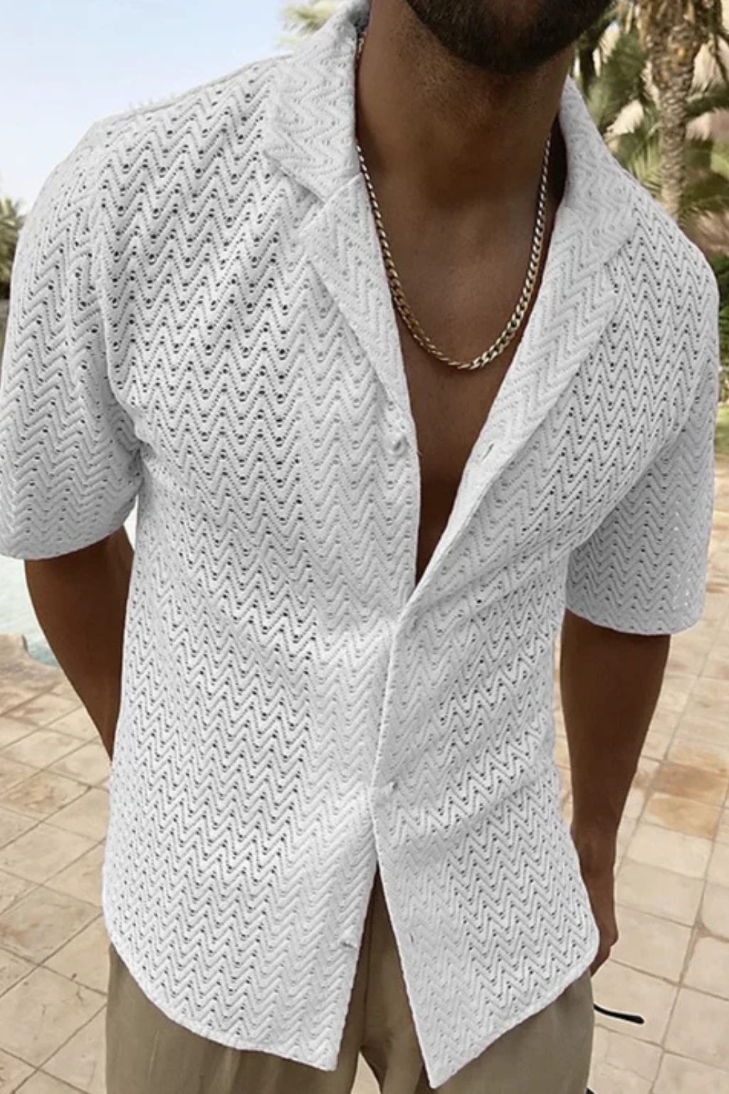 Casual men's open collar top with a stylish chevron pattern and short sleeves for summer fashion.