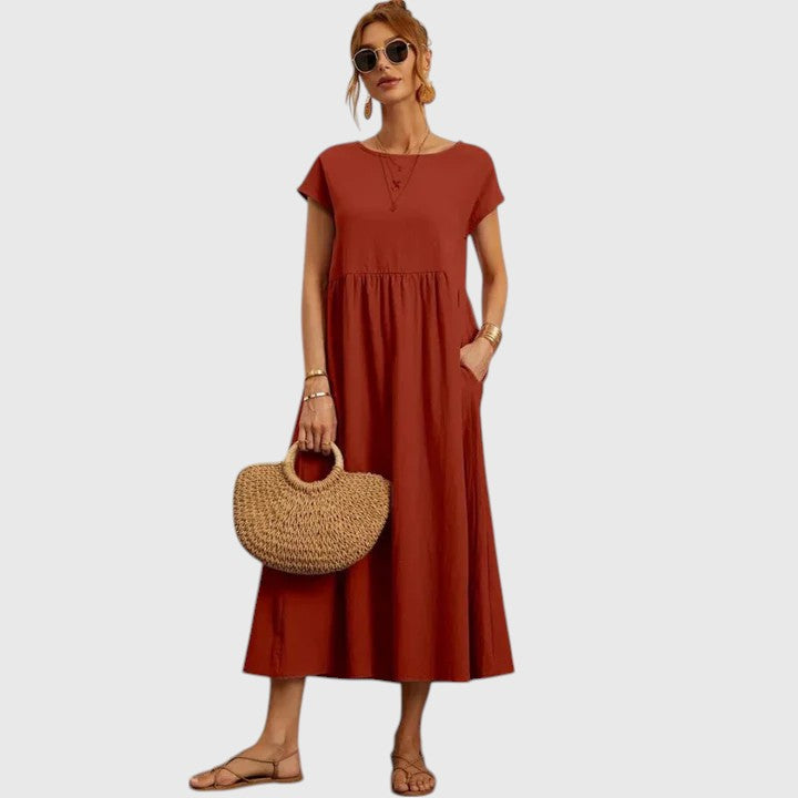 Effortless women's midi dress, chic, comfortable, short sleeve, with pockets – versatile everyday wear.