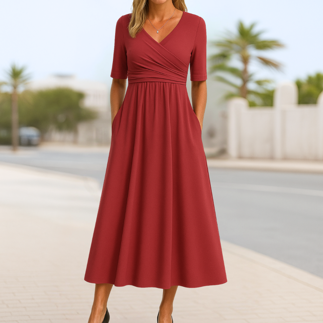 Sophisticated women's short sleeve day dress featuring a flattering crossed V-neck and flared skirt.
