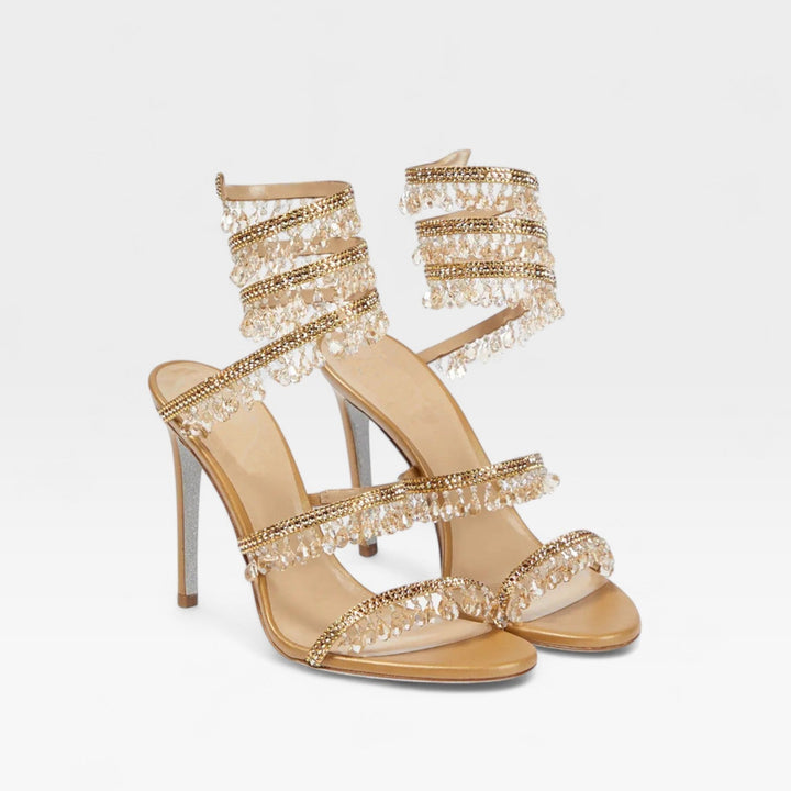 Shimmering women's strappy high heel sandals, perfect formal footwear for luxury evening events.