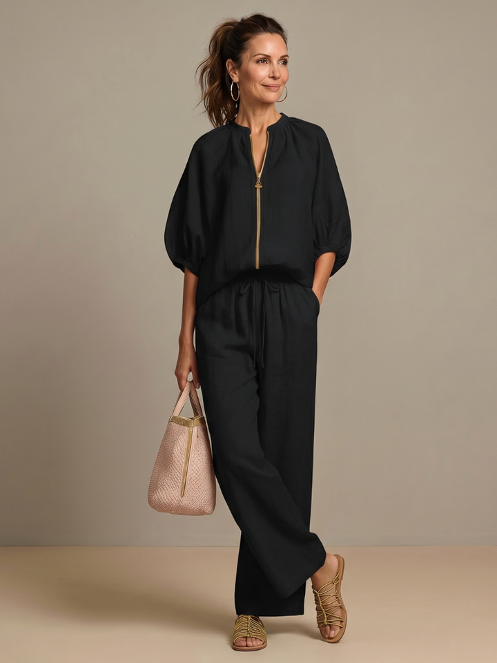 Women's comfortable zip front blouse and wide leg pant set. Versatile for spring/summer fashion.