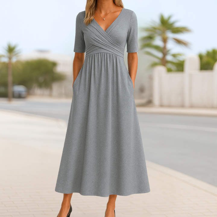 Spring/summer women's casual dress. Features an elegant crossed V-neck and comfortable short sleeves.