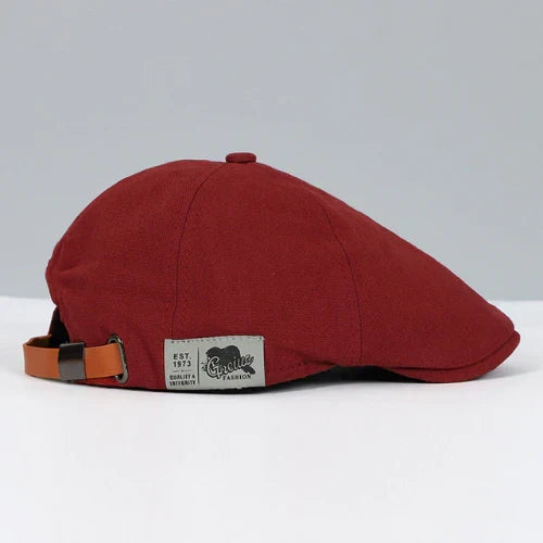 Paneled men's ivy cap headwear, classic style with button top & adjustable buckle for a comfortable fit.