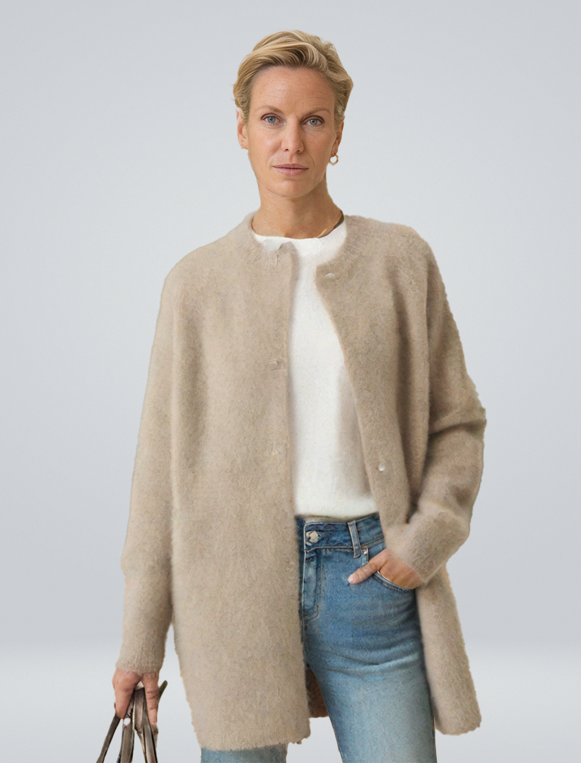 Women's minimalist longline button cardigan, a chic and versatile layering piece for autumn style.