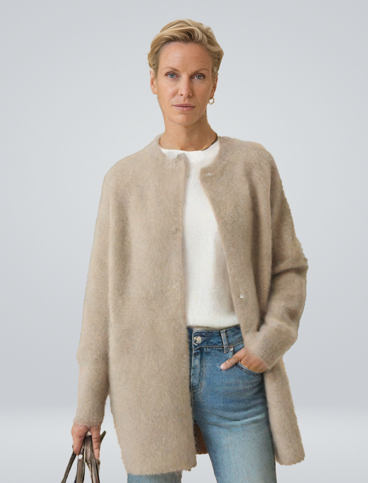 Women's minimalist longline button cardigan, a chic and versatile layering piece for autumn style.