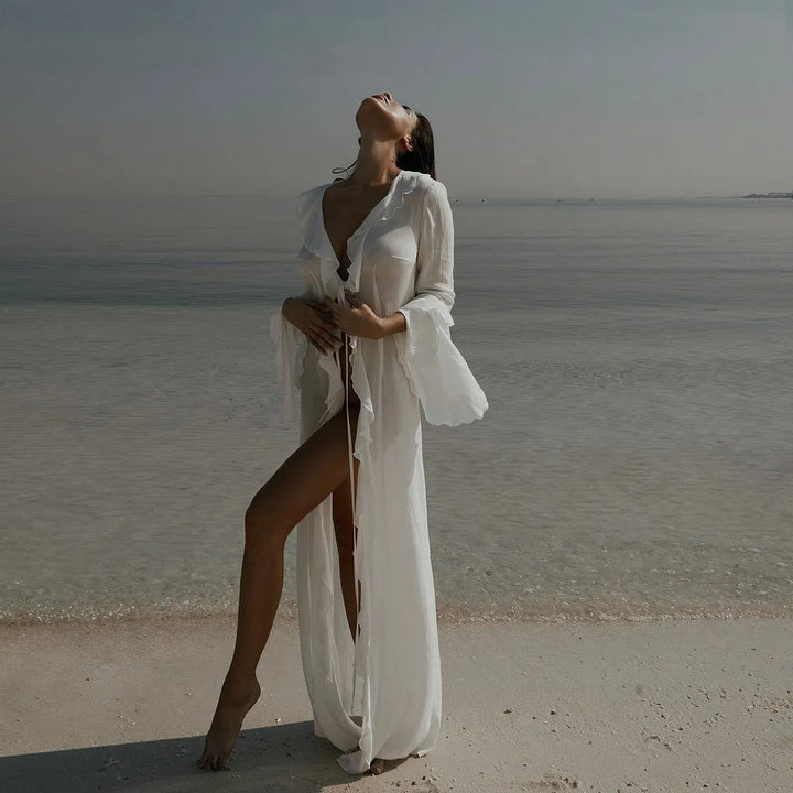 Comfortable women's flowy long sleeve maxi dress for beach, resort or casual summer wear. Offers stylish sun protection.