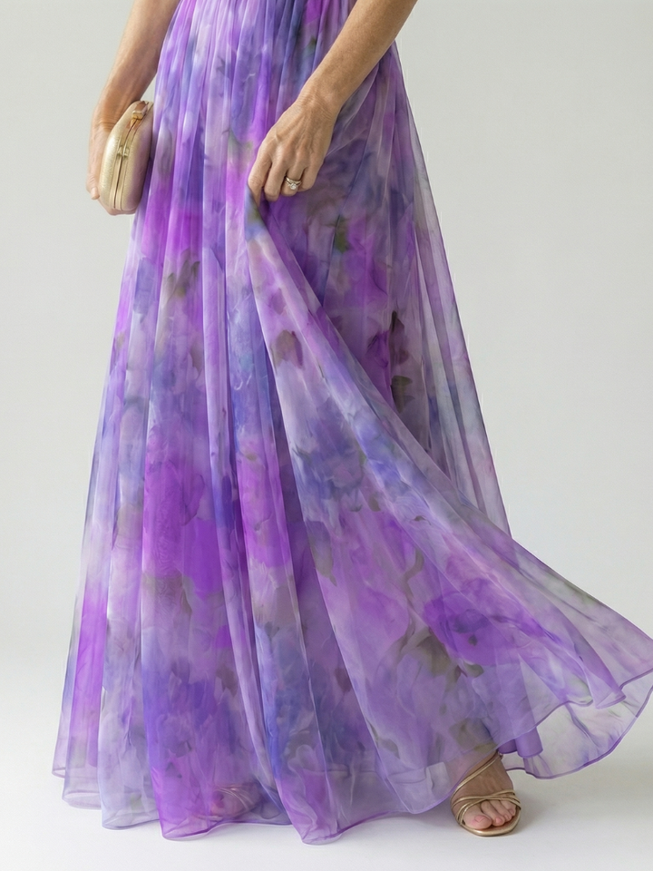 Maxi length women's wrap dress, sleeveless, flowy, soft, vibrant for summer vacation fashion.