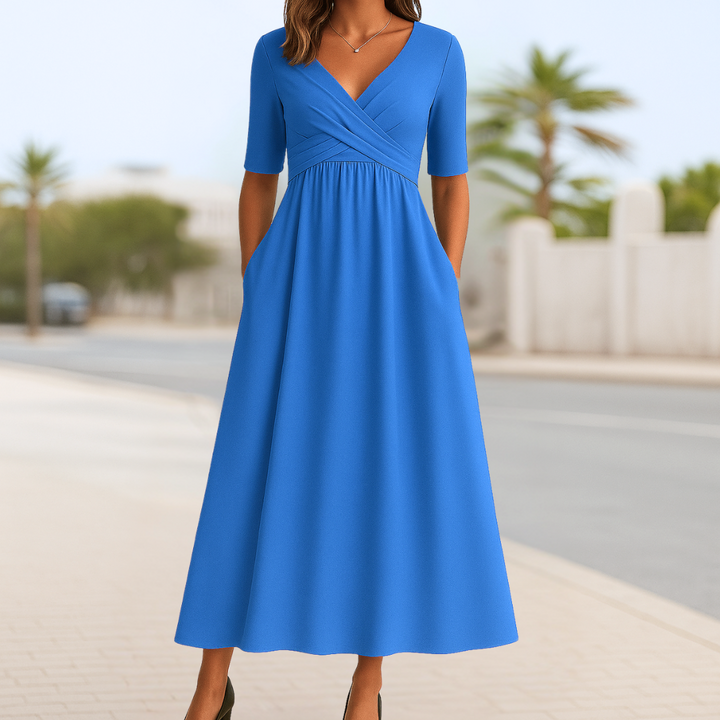 Versatile women's midi dress. Enjoy comfort and style with its crossed V-neck, short sleeves & flared design.