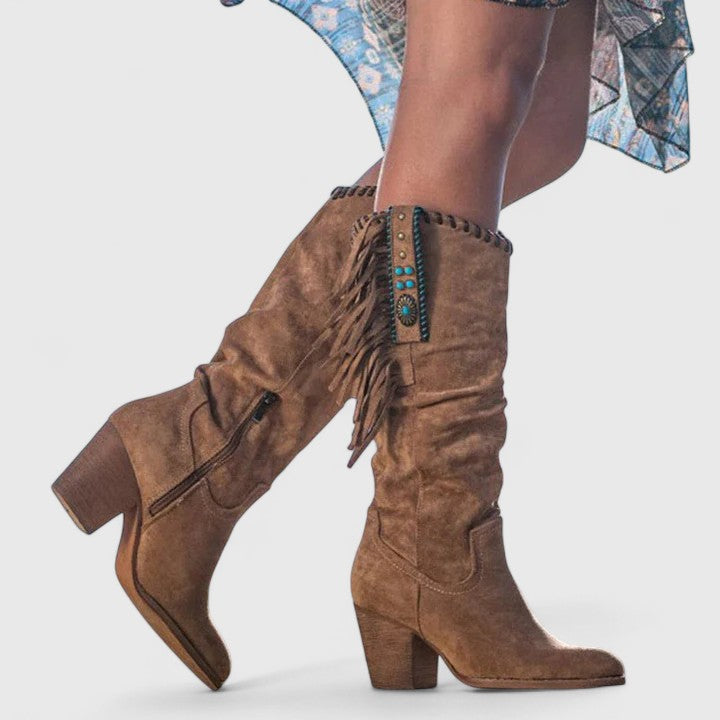 Versatile women's mid-calf boots showcasing chic fringe detail and a practical block heel, suitable for any occasion.