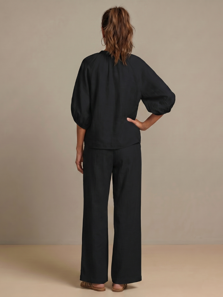 Modern women's zip front blouse & wide leg pant set. A chic and comfortable outfit for versatile styling.