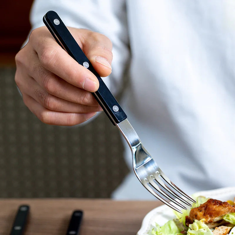 Modern western design 24-piece stainless steel cutlery set, ideal for sophisticated dinnerware.