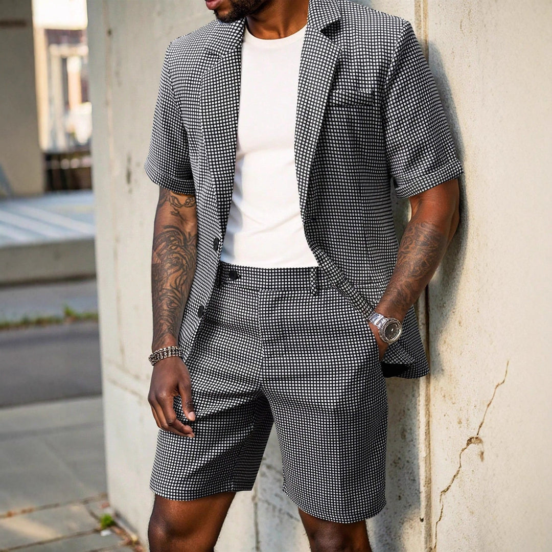 Men's modern black check print blazer and coordinating shorts, a fashionable two-piece summer outfit.
