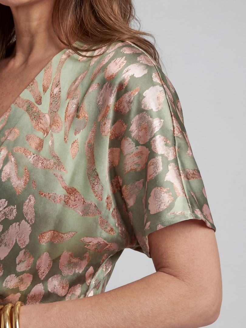Comfortable women's abstract print midi dress with a twist waist. Versatile for day or evening wear. V-neck, short sleeve.
