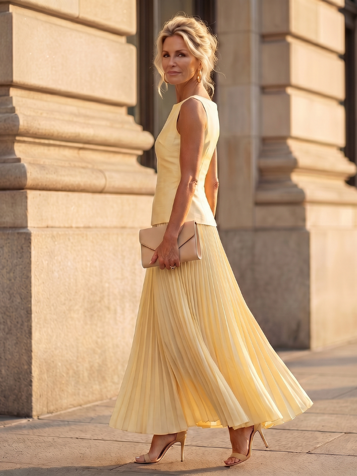 Versatile women's two-piece set: structured bodice & flowing pleated skirt for formal or casual wear.