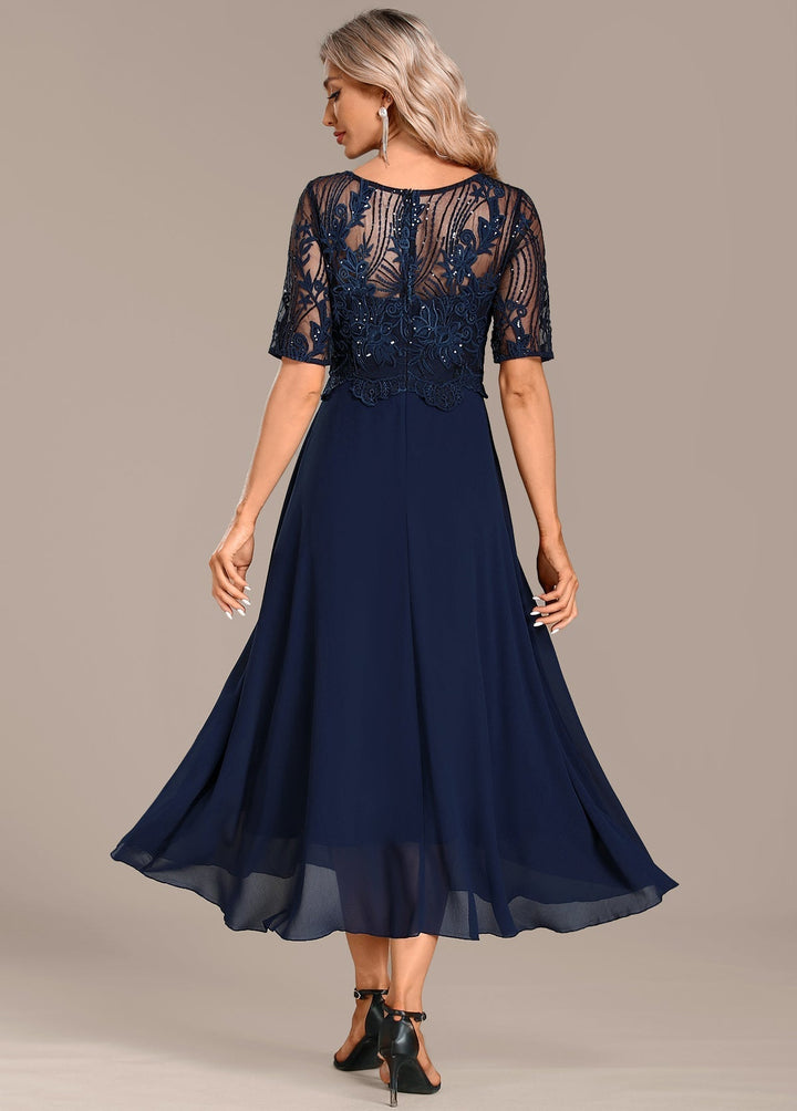 Flattering navy lace midi dress for women, featuring elegant floral lace and a classic silhouette.