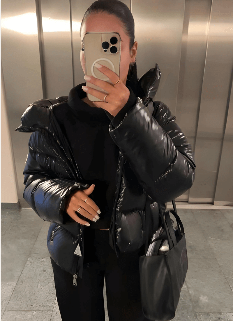 Women's slim-fit winter puffer jacket, designed for style and warmth. Ideal cold weather fashion apparel.