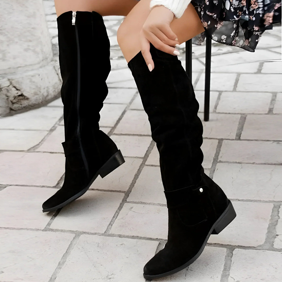 Elegant women's tall boots, featuring a comfortable block heel and fashionable strap detail.