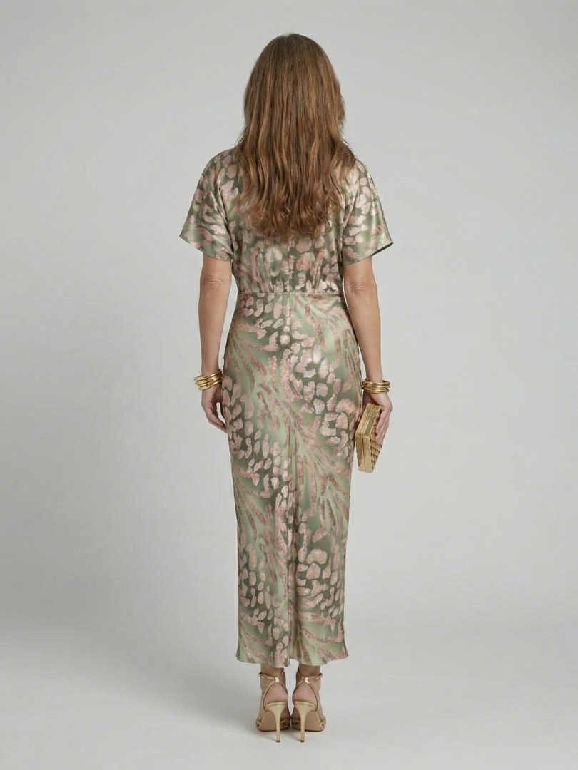 Stylish women's midi dress featuring a modern abstract print, elegant V-neck, and trendy twist waist. Short sleeve, comfy.