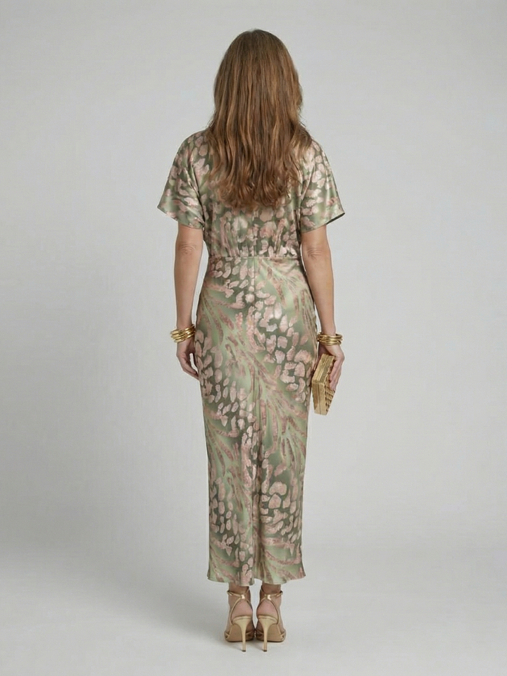Stylish women's midi dress featuring a modern abstract print, elegant V-neck, and trendy twist waist. Short sleeve, comfy.
