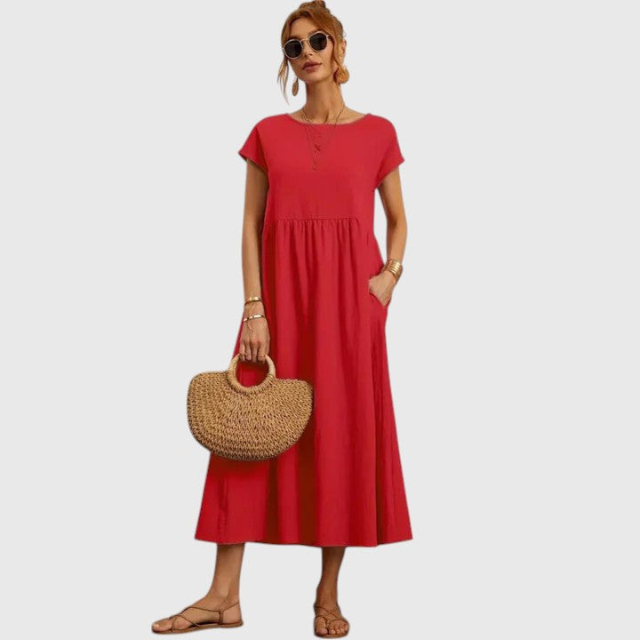 Relaxed fit women's midi dress, comfortable & chic for everyday, with short sleeves & elegant round neck.