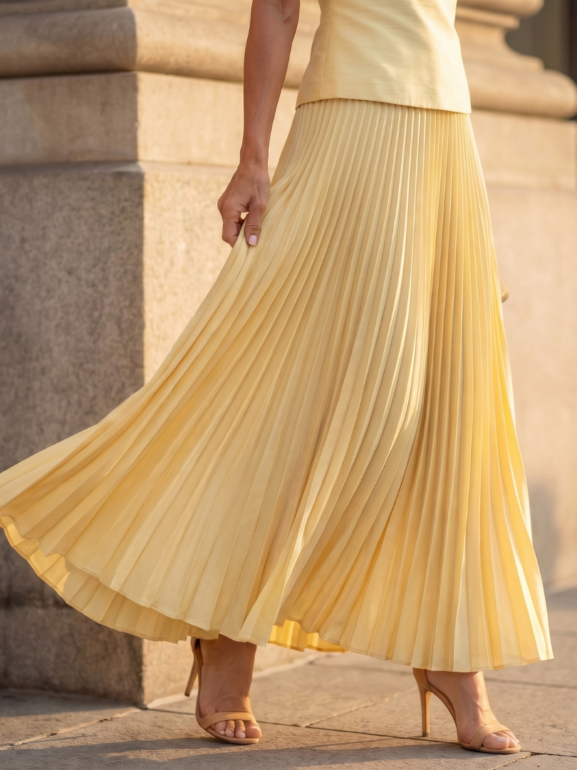 Chic women's sleeveless structured bodice & pleated skirt set. Elegant two-piece for various occasions.