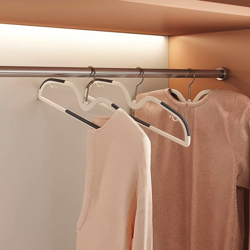 Compact 40-pack of space-saving plastic clothes hangers with non-slip finish and rotating hooks for optimal organization.