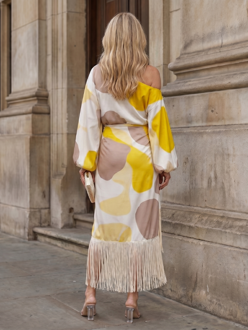 Casual spring women's midi dress, abstract print, relaxed fit, off-shoulder design, and stylish fringe hem.