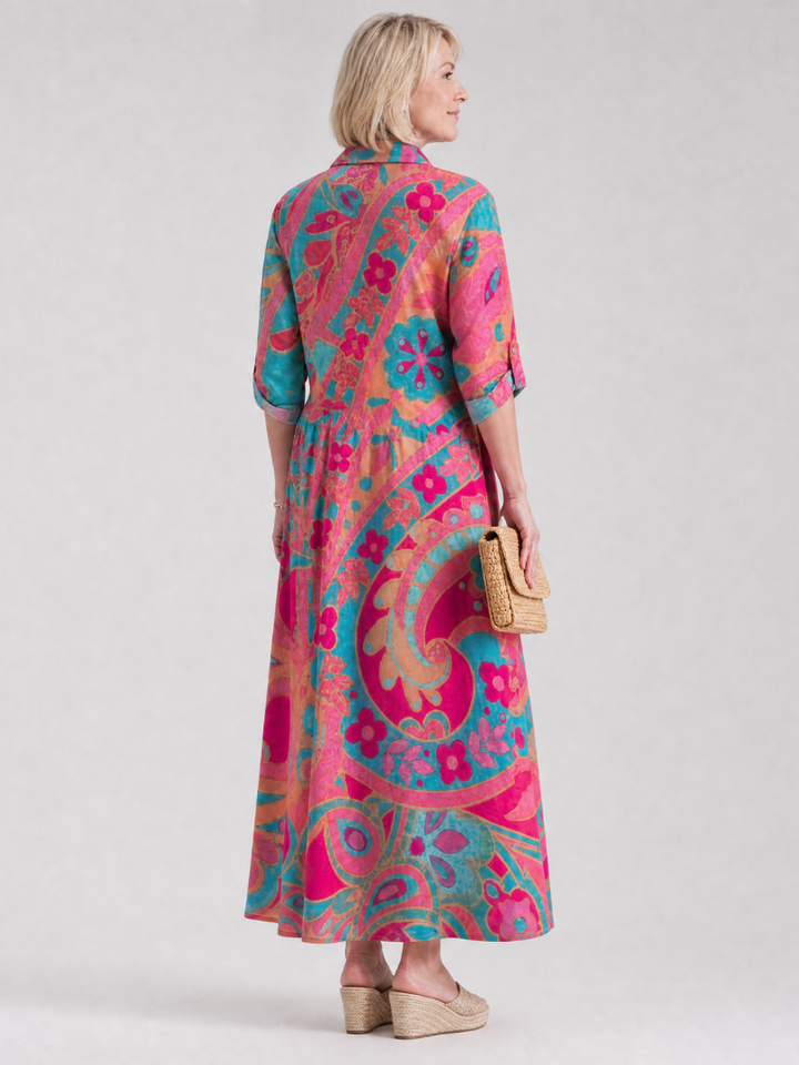 Elegant printed midi dress for women featuring button front, collar, and 3/4 sleeves. Ideal casual summer fashion.
