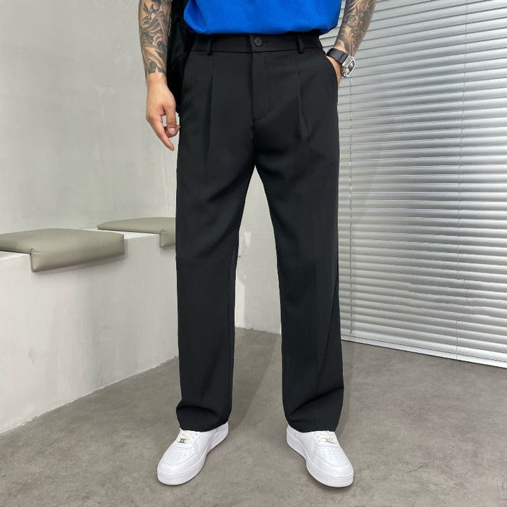 Stylish men's professional wide-leg dress pants, double pleated for a sophisticated tailored fit. Versatile.