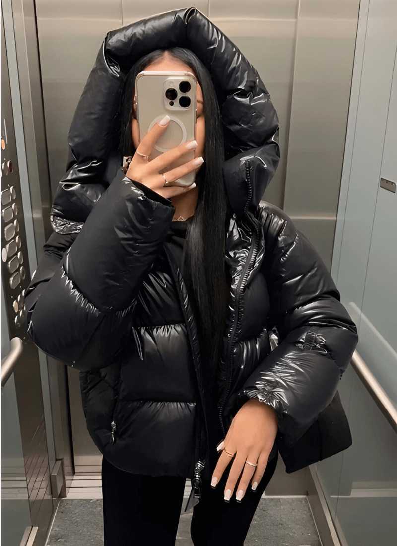 Stylish women's slim-fit puffer jacket with a glossy finish. Fashionable winter outerwear for warmth & everyday wear.