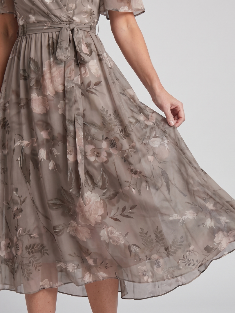 Comfortable spring fashion: women's v-neck floral midi dress, flutter sleeves, and cinched waist.