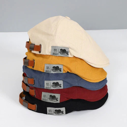 Men's Classic Ivy Cap with adjustable buckle & distinctive button top for timeless style.