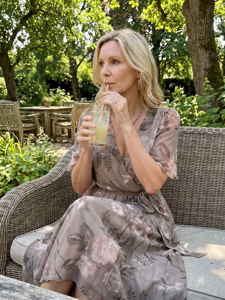 Versatile women's floral midi dress, flutter sleeves, v-neckline, suitable for casual or elegant wear.