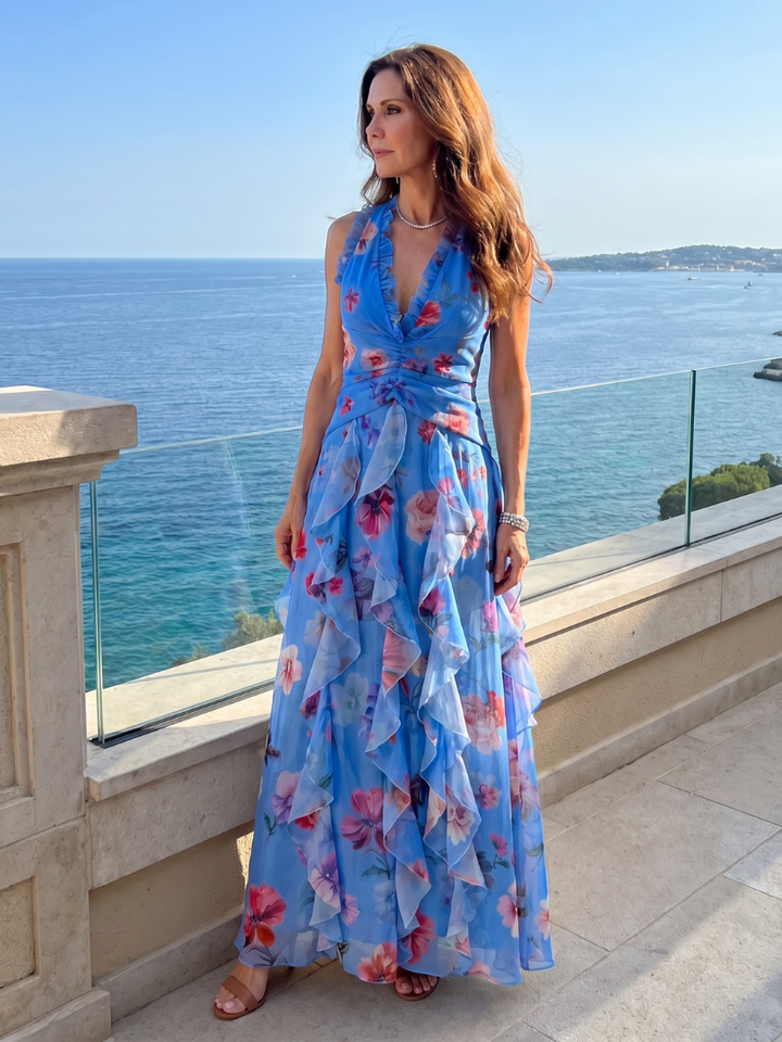 Versatile women's floral halter neck maxi dress with ruched details, perfect for elegant parties or summer days. [[lstfy-media:8]]