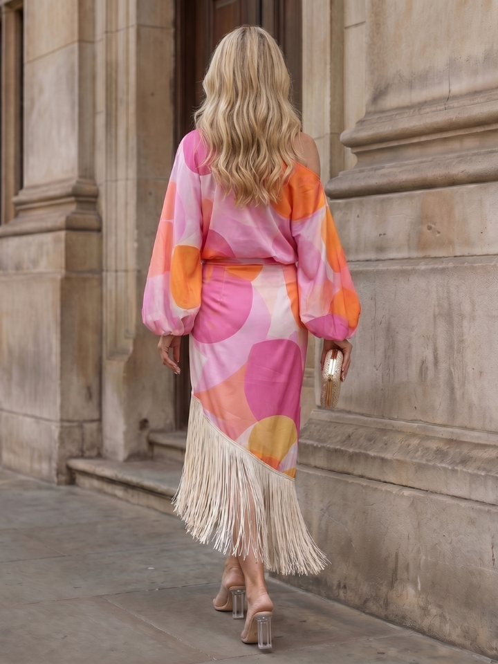 Women's off-shoulder abstract print midi dress with long sleeves, relaxed fit, and chic fringe hem.