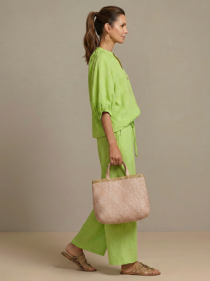 Women's fashion two-piece set: zip front long sleeve blouse and comfortable wide leg pants. Spring casual.