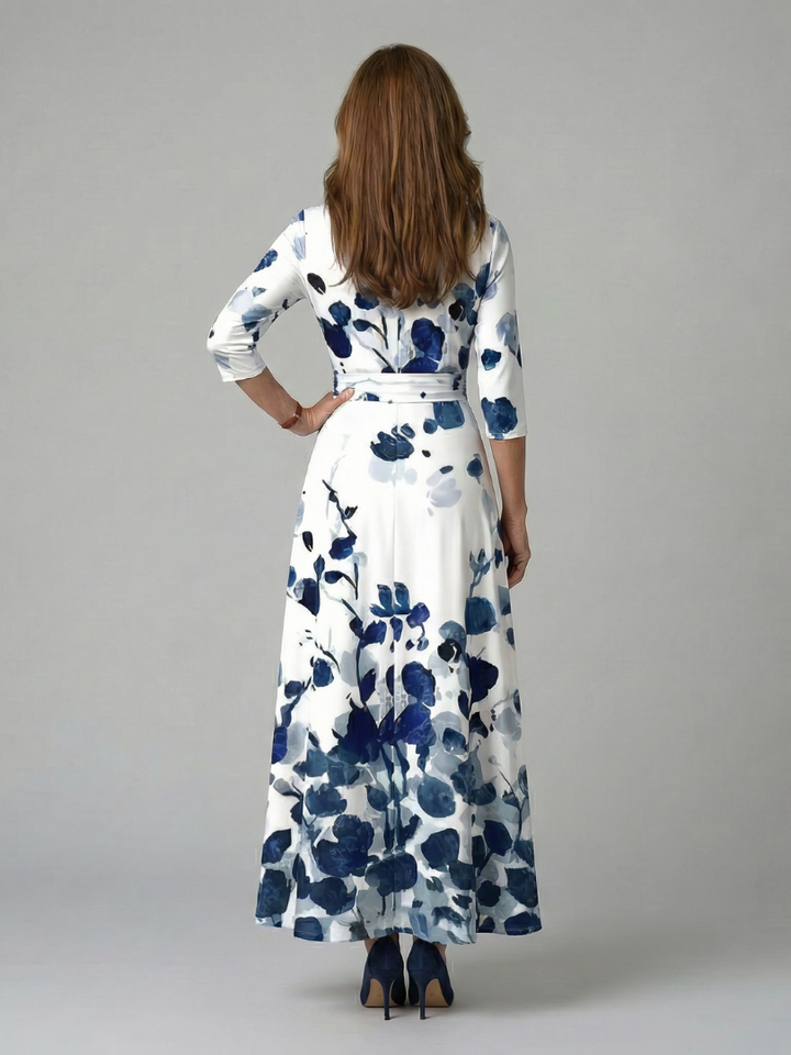 Chic women's floral cross wrap midi dress styled for a spring event, elegant & fashionable.