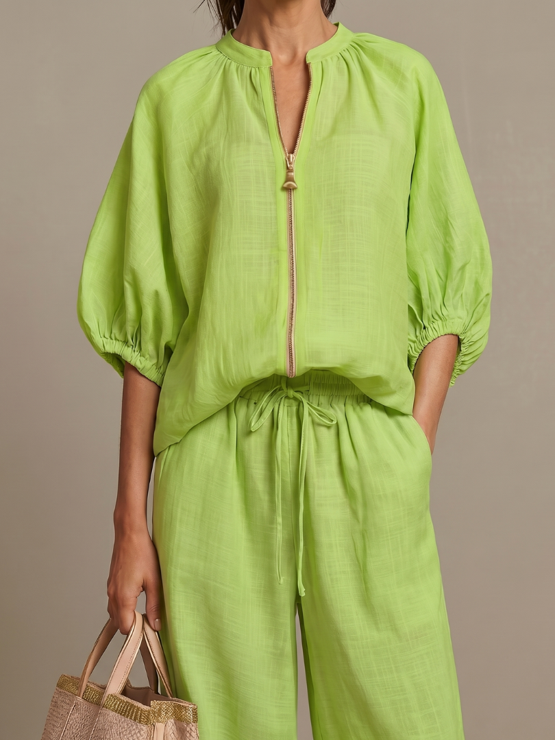 Stylish women's zip front blouse & wide leg pant set. A comfortable, elegant outfit for versatile wear.