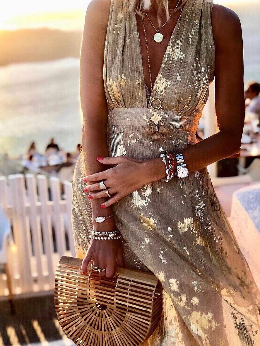 Sparkling women's bronze sequin V-neck long dress, sophisticated party wear with a glamorous feel.