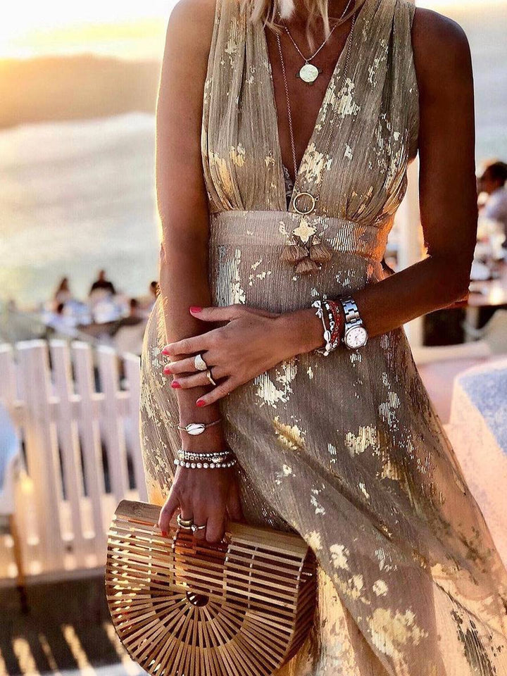Sparkling women's bronze sequin V-neck long dress, sophisticated party wear with a glamorous feel.