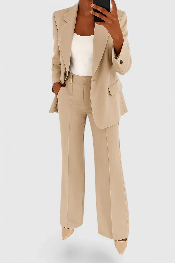 Modern professional women's two-piece suit. Chic business attire for the office and elegant formal occasions.