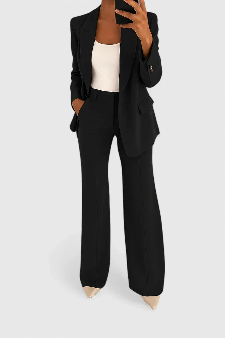 Elegant women's two-piece suit set for professional work or formal events. Classic tailored pantsuit for modern women.