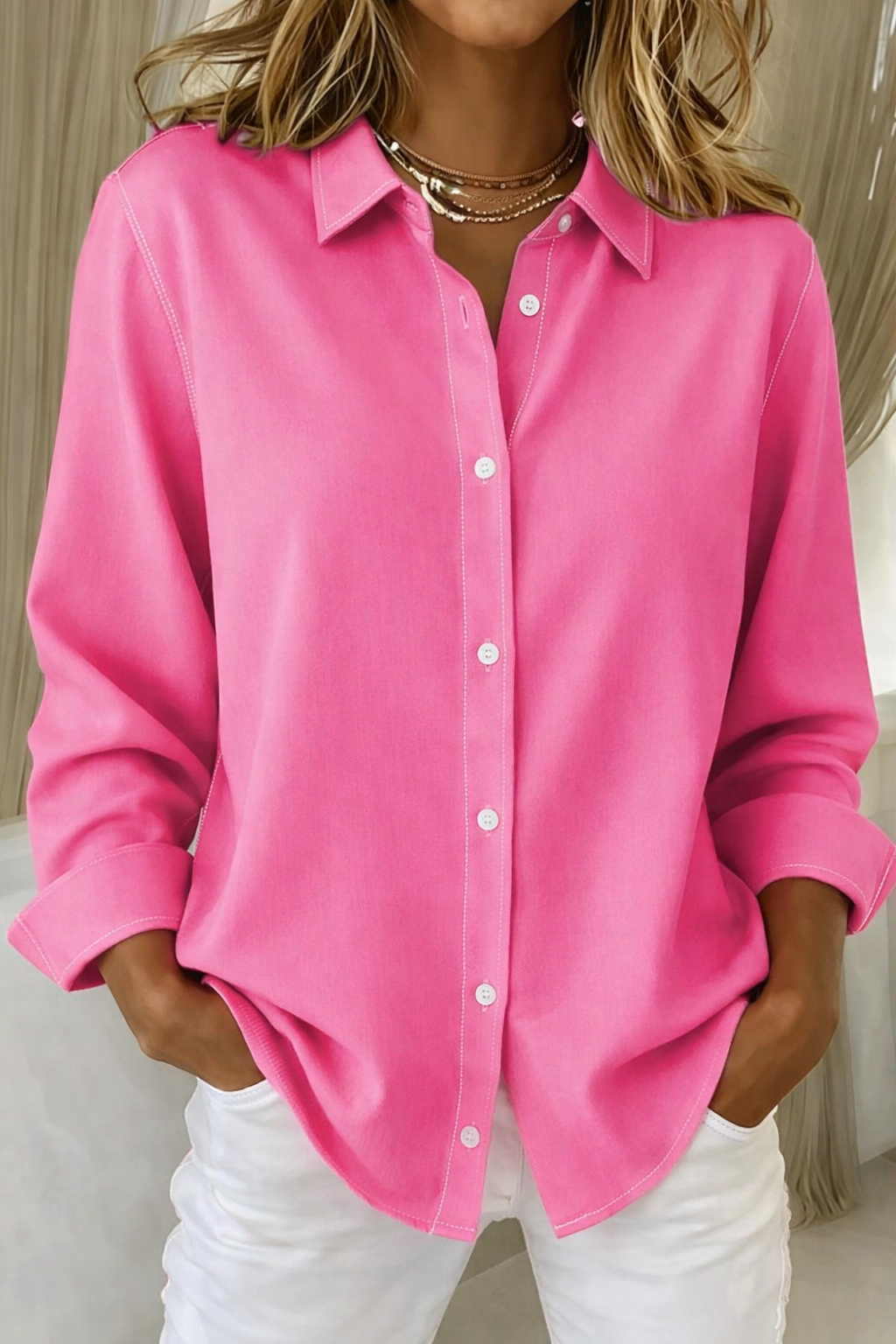 Women's effortless loose fit button-down blouse with point collar, perfect for versatile everyday chic.
